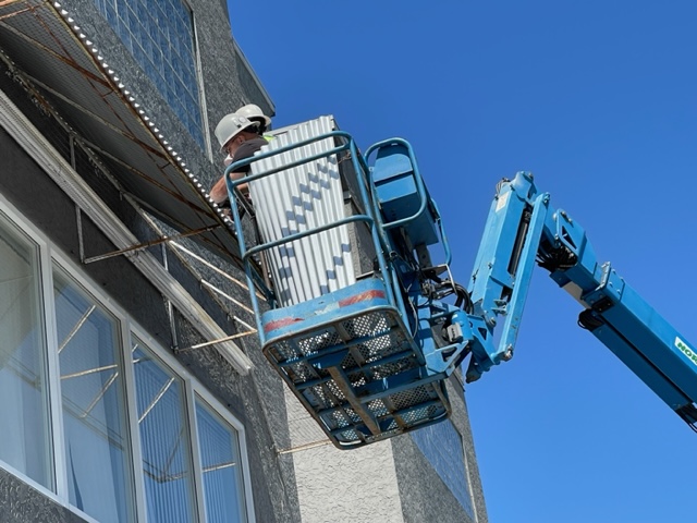 L&L Signs & Neon Ltd |  Crew on Cherrypicker doing Installation